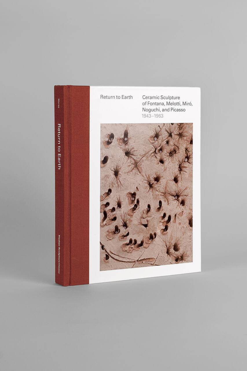Book titled "Return to Earth," features a brown spine and a cover with abstract ceramic art consisting of textured, earth-toned surfaces with scattered circular indentations and wispy lines.