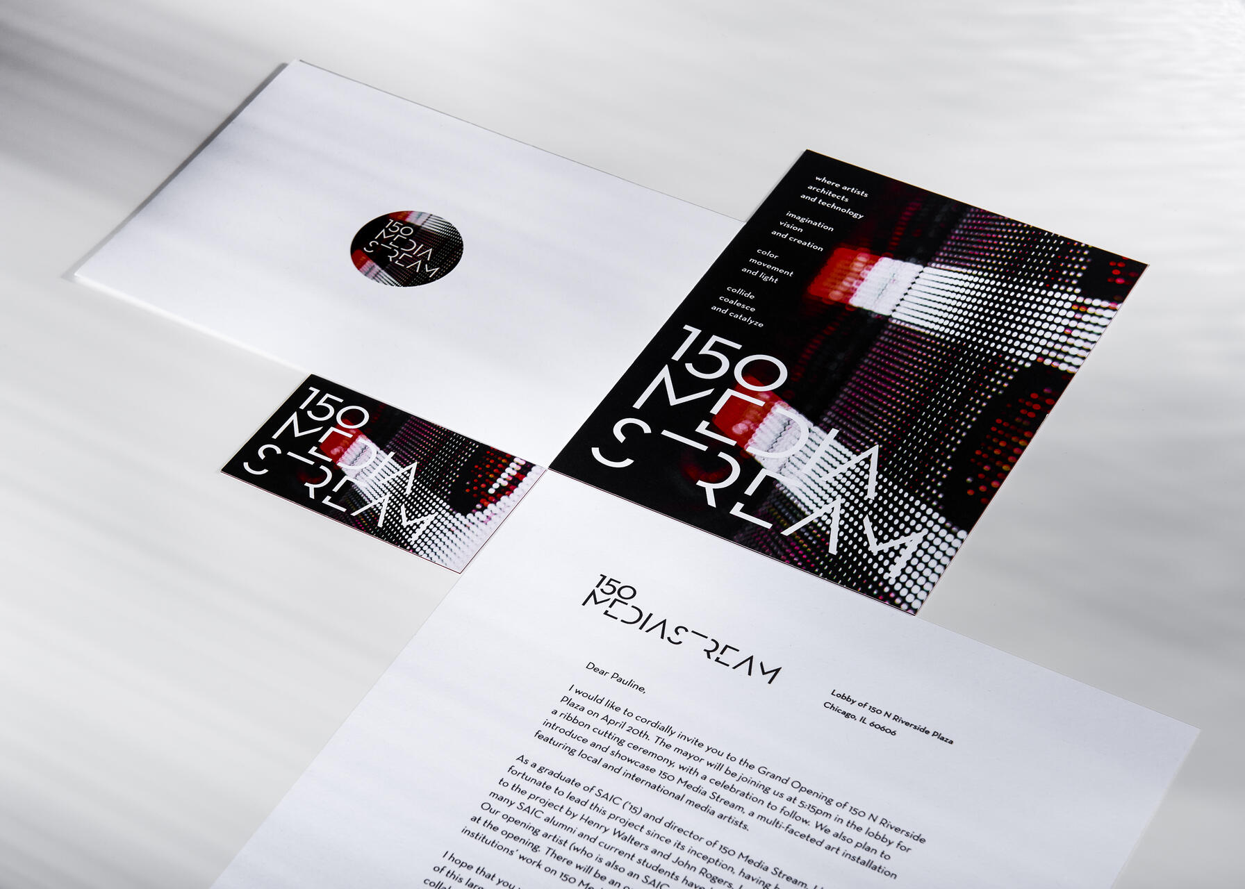 Stationery set with a modern design featuring a letter, envelope, and card. The letterhead and card display "150 Media Stream" with abstract digital graphics in red, black, and white. The design is sleek and contemporary, emphasizing innovation and creativity.
