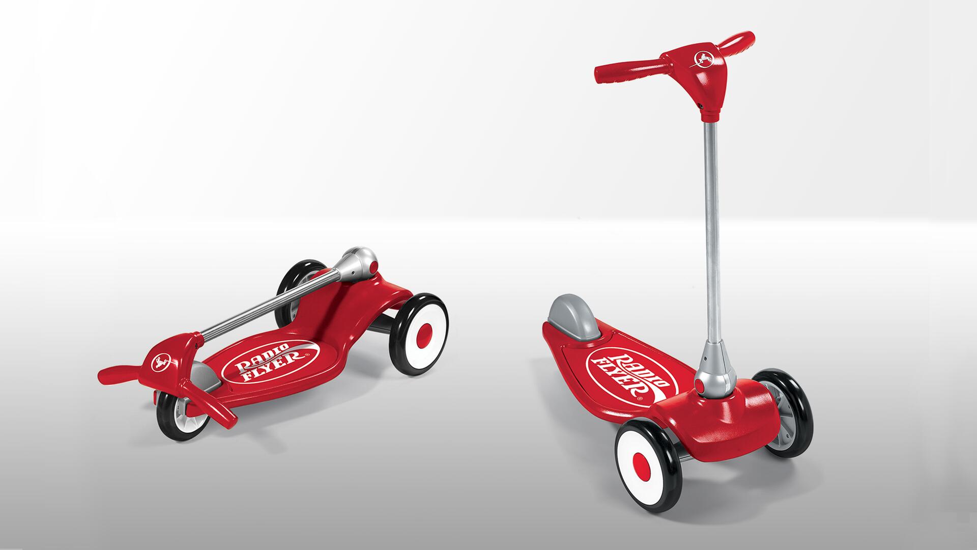 Red Radio Flyer scooter in two positions; one collapsed flat, the other upright with red handlebars and three black-and-white wheels, on a light gray background.