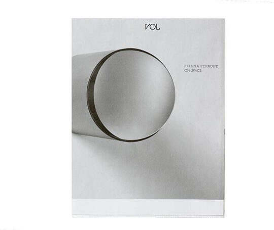 Minimalist book cover featuring a large, abstract, cylindrical shape in gray tones, set against a white background. Title and author names are printed in small text near the top and right side.